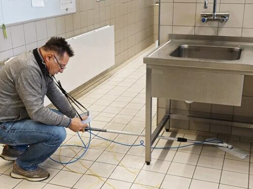 technician checking floor